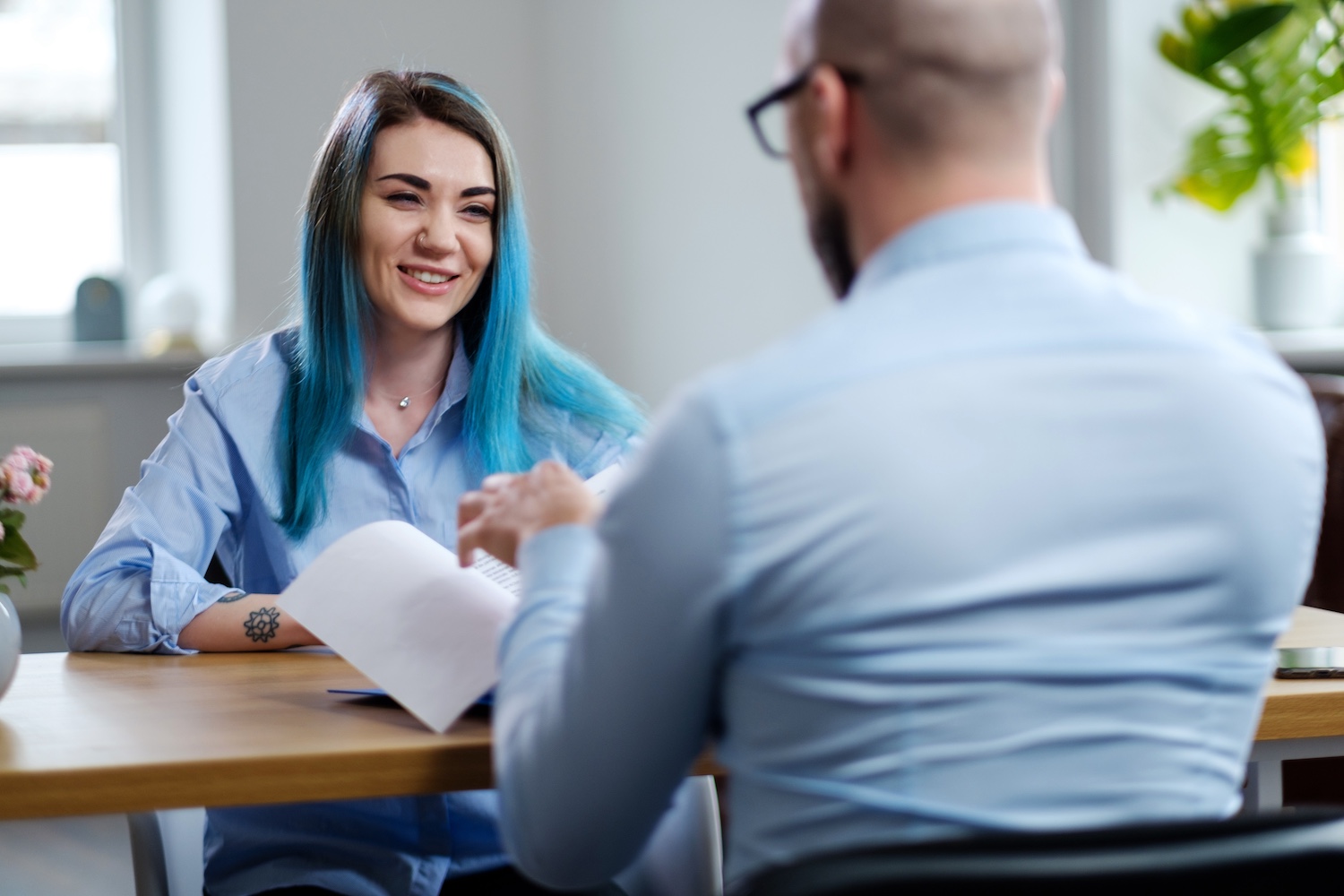 Alternative young woman attending job interview Alternative young woman attending job interview.