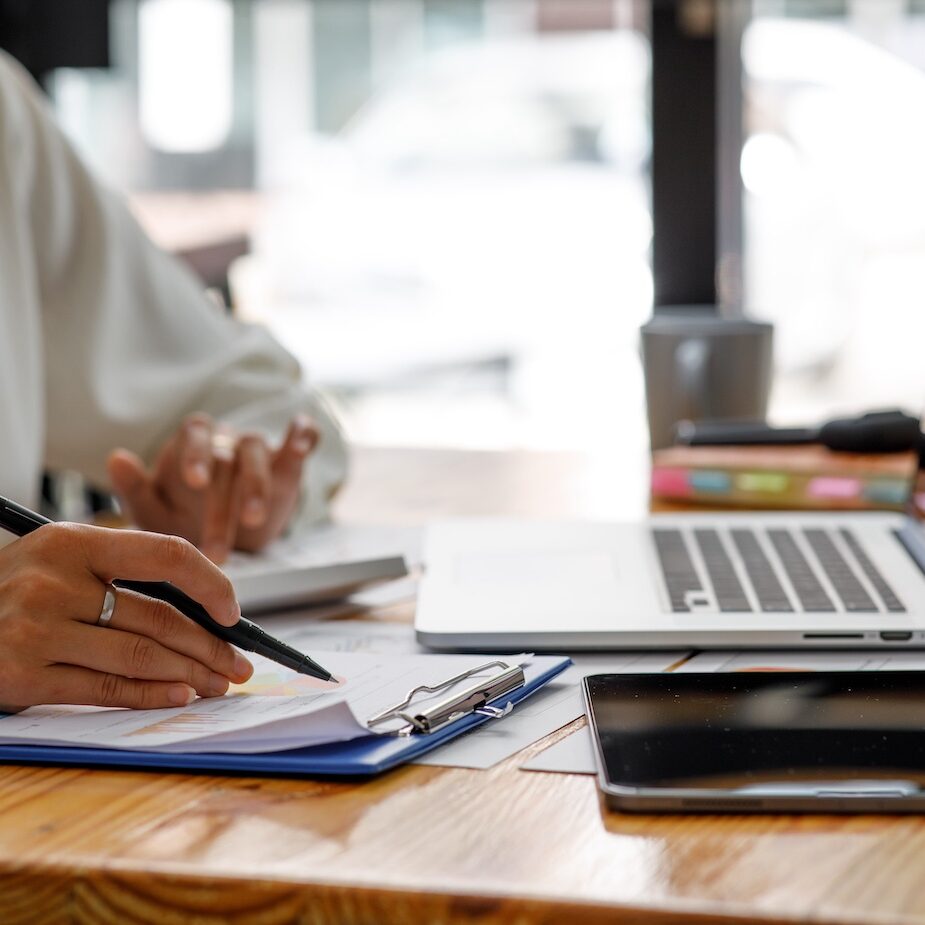 Businesswoman working at office with documents on his desk, doing planning analyzing the financial report, business plan investment, finance analysis concept